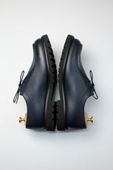 Navy leather lace-up casual shoes with rubber sole for smart-casual weekend wear.